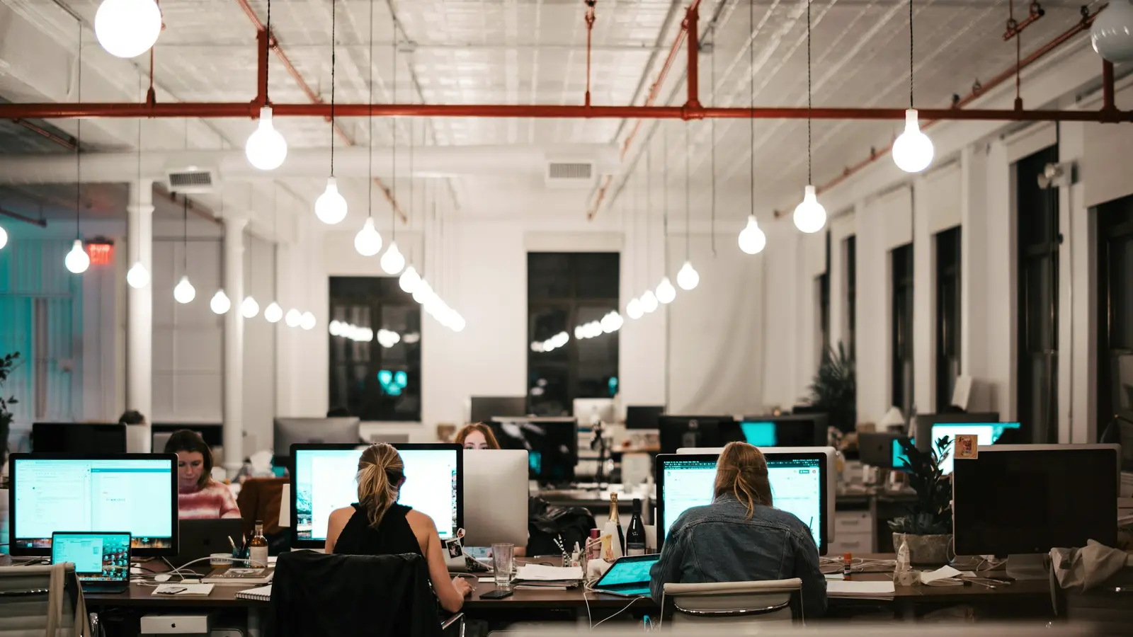 A team at work in an open-plan loft office